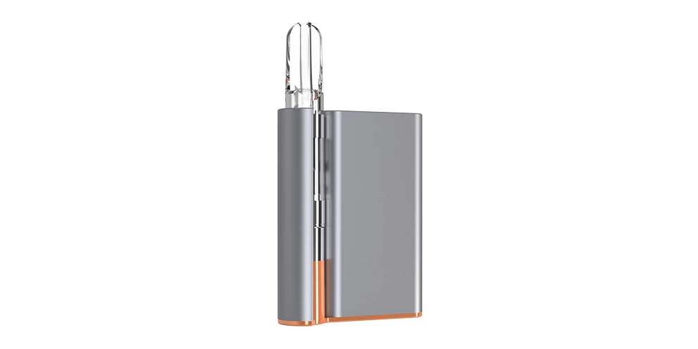 A silver CCELL Palm vape battery with gold detailing